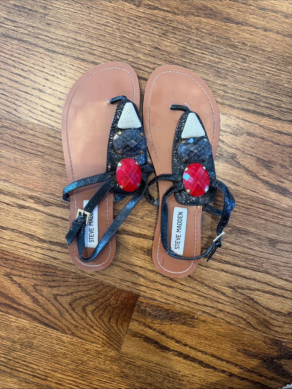 Steve Madden Black T-Strap Sandals with Red Gem Accent